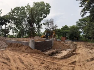 2. Preparing the building site for pouring the foundation slab. Getting a closer look as the boundary walls start to take shape.