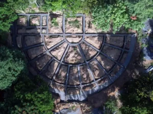 1. A photograph taken from a drone flying high over the foundation construction underway of the new satsang hall building.